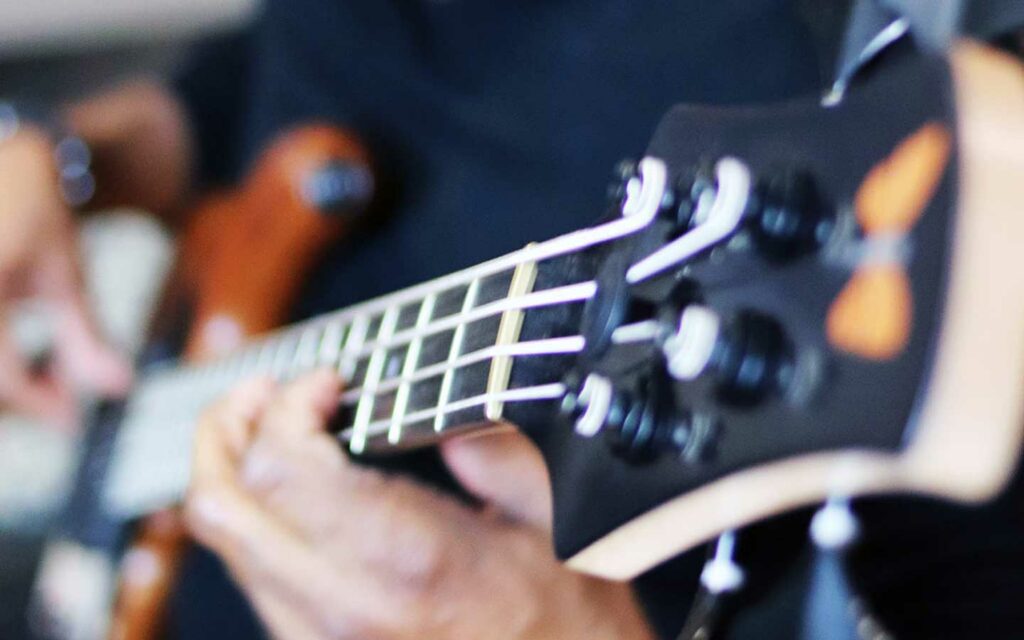 Closeup of the neck of a bass guitar